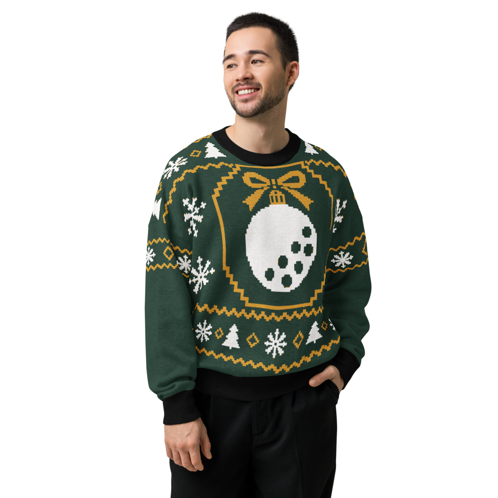 Winter Fairway Strickpullover mit schwarzer Hose getragen; Frontansicht des grünen Golfball-Weihnachtsmotivs.